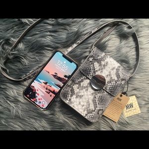 Minimalist leather small bag with mobile phone